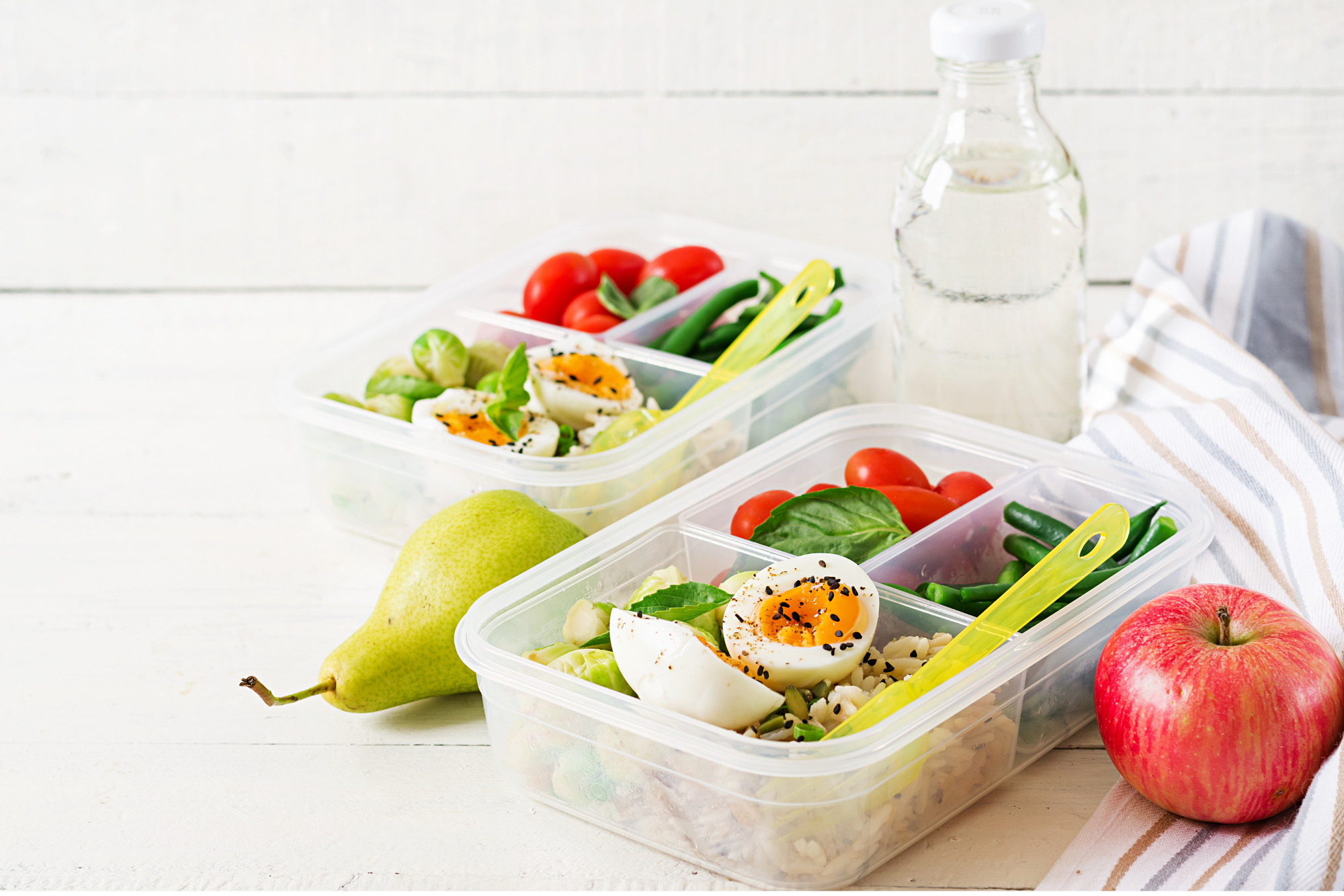 weight loss meal prep ideas. two containers of eggs, veggies and fruit on the side. 