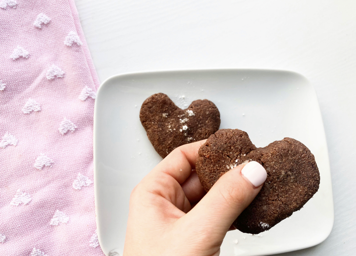 holding heart shaped low carb brownies