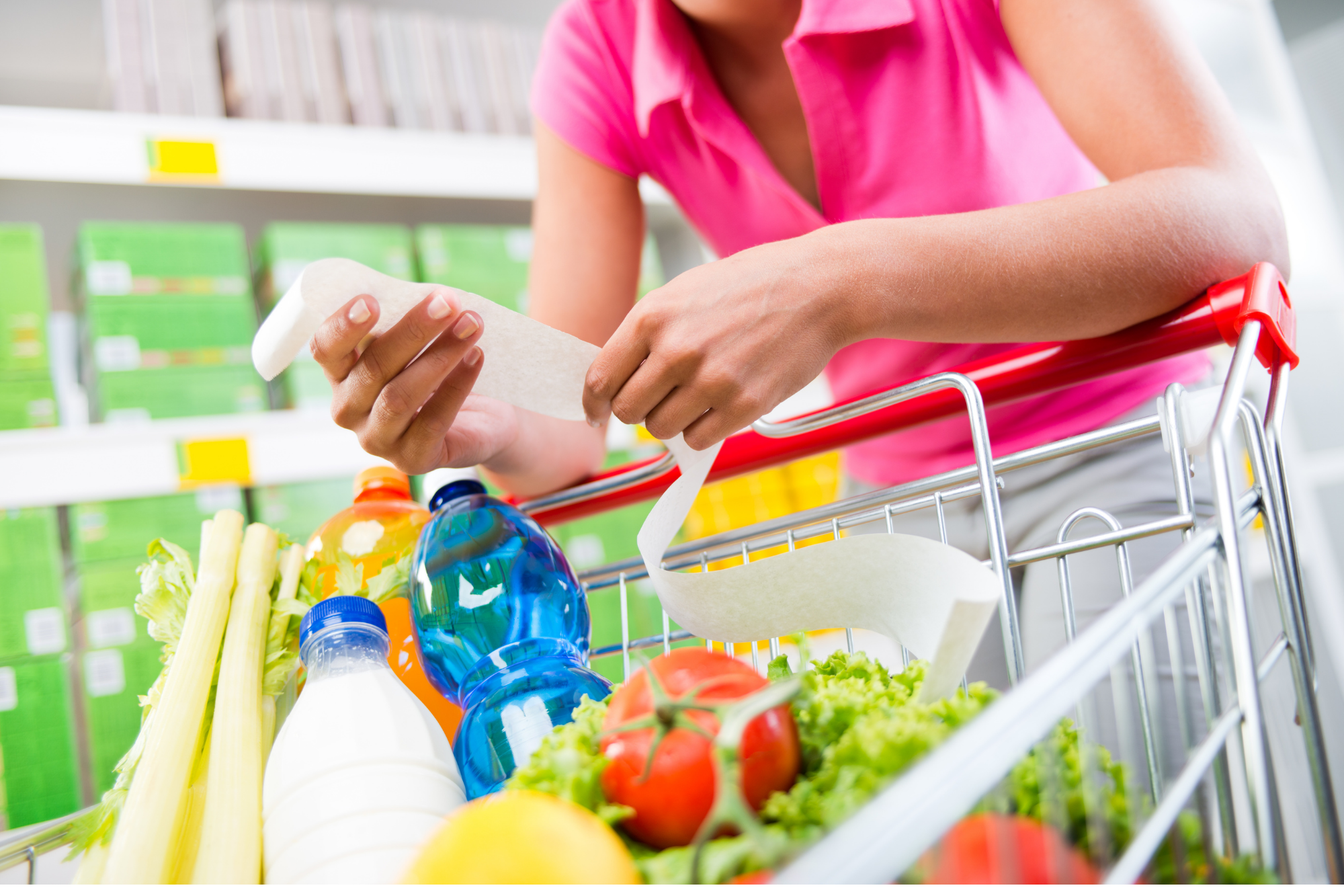 low carb on a budget women looking at grocery list in store