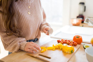 women cutting vegetables