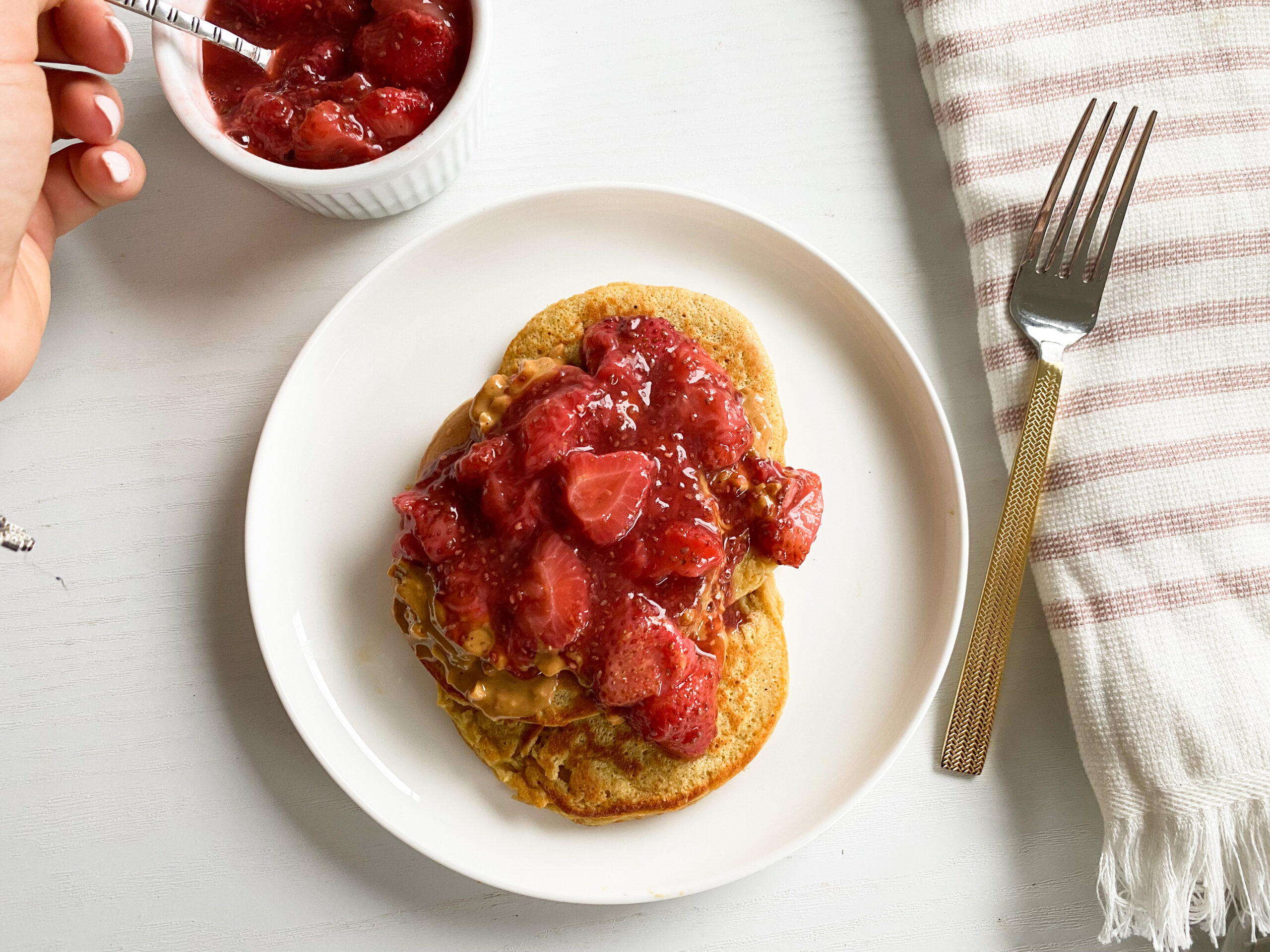 protein pancakes on a plate with berry chia jam